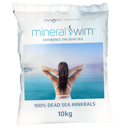 Bag of mineral swim with a person at the Dead Sea, featuring Maytronics branding.